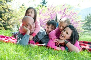 Happy family smiling and having fun outdoors