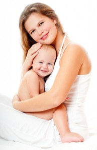 Young mother hugging baby